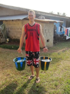 Ben hauling water in his favorite (and Angie's least favorite) shorts
